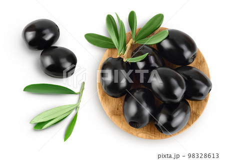 Black olives with leaves in wooden bowl isolated on a white background with full depth of field. Top view. Flat lay 98328613