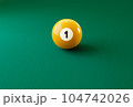 Billiard ball number one isolated on the green table 104742026