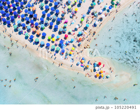 Aerial view on beach, people and umbrellas. Vacation and adventure. Europe, Mediterranean Sea. 105220491