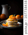 Plate of pancakes drizzled with maple syrup and topped with oranges, created with Generative AI technology. 107738438