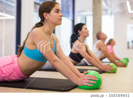 Young woman doing exercises with pilates ball 108389931