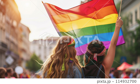 Lady holding rainbow color flag, symbol of LGBT pride month celebrate annual in June social of gay, lesbian, bisexual, transgender, human rights. 114932700