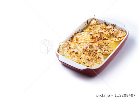 Potato gratin baked with cream and cheese isolated on white background 115209407