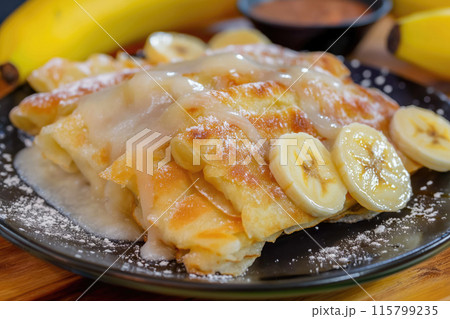 plate of thai roti pancakes with bananas 115799235