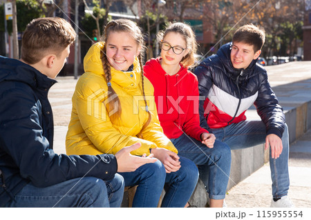 Teenagers are communicating on walk in the city 115955554