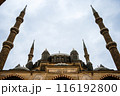 Low angle view of a mosque with four tall minarets against a cloudy sky, Mosque of Selim II, Edirne, Turkey. 116192800