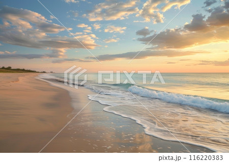 Peaceful misty beach at sunrise with gentle waves 116220383