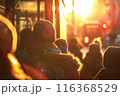 A crowd of people walking through the city on a sunny day at sunset. Hurry and lifestyle concept. blurred image 116368529