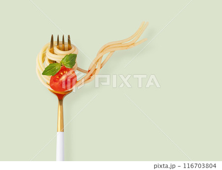 Levitating spaghetti on a fork with a piece of tomato, sauce and basil on a green background. 116703804