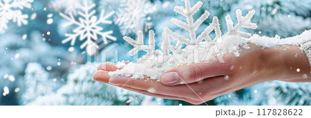 Close up of hands holding big snowflake, Christmas, new year concept 117828622