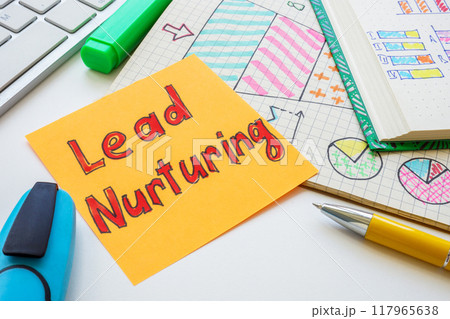 Marketing charts and note with lead nurturing. 117965638