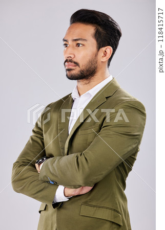 Business, serious and Asian man arms crossed, leadership and concentration with guy against a grey studio background. Male entrepreneur, employee and manager with thoughts, thinking and future ideas 118415717