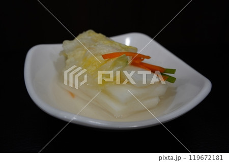 White kimchi is a type of kimchi made without using red pepper powder in Korean cuisine 119672181