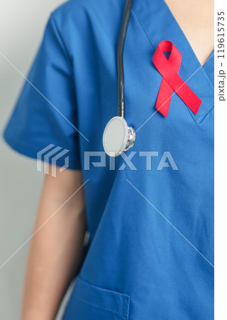 Doctor with Red Ribbon for December World Aids Day, acquired immune deficiency syndrome, multiple myeloma Cancer Awareness month and National Red ribbon week. Healthcare and world cancer day concept 119615735