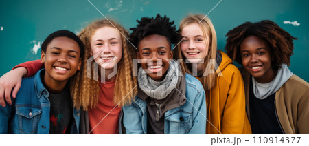 Multiethnic friendship and people concept. Diverse teens hugging and having fun 110914377