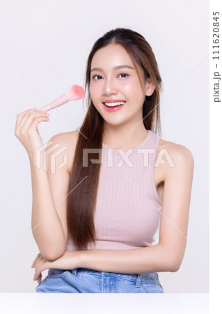 Beautiful young Asian woman with healthy and perfect skin on isolated white background. Facial and skin care concept for commercial advertising. 111620845