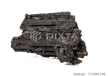 Macro stone black mineral tourmaline Scherl on white background 111882146