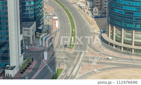 Top view city traffic on a crossroad in Dubai Downtown timelapse. 112976690