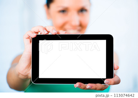 young smiling brunette woman holding a touch pad 113074642