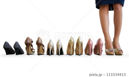 Woman, many shoes and studio floor with choice, mockup space and feet for fashion by white background. Person, model and high heels for trendy style, decision and legs for promotion with retail deal 113334913