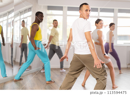 Group of people dancing modern dances 113594475