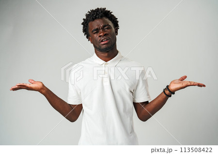 Man Standing With Hands Out in Front of Him palms facing up 113508422