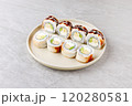 Japanese Sushi Rolls Philadelphia Uramaki Plate on Gray Background for Restaurant Menu or Food Delivery 120280581