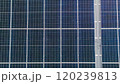 Photovoltaic solar panels on roof get clean energy from the sun. Slow motion. Aerial view. Solar Panel Array. Drone Aerial View of Modern Photovoltaic Electricity System, Close Up. 120239813