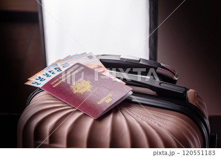 International passport of a French citizen on a suitcase 120551183