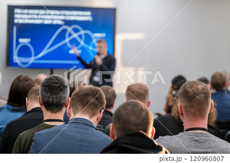 Business presentation with graph and audience in a conference setting 120960807