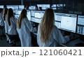 Scientists analyzing data on computers in advanced research laboratory 121060421