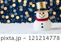 Smiling snowman wearing golden hat and red scarf during snowfall 121214778