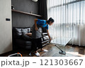 cleaning service housekeeper women swipe floor in living room. House cleaning service concept 121303667