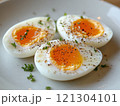 Delicious soft-boiled eggs with seasoning kitchen table food photography bright lighting close-up culinary delight 121304101