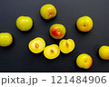 Fresh green plum fruit on dark background. 121484906