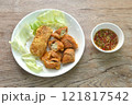 fried slice Vietnamese chicken sausage recipe with cabbage on plate dipping spicy sauce 121817542