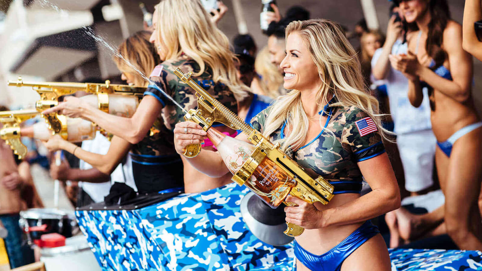 Waitresses spraying Champagne