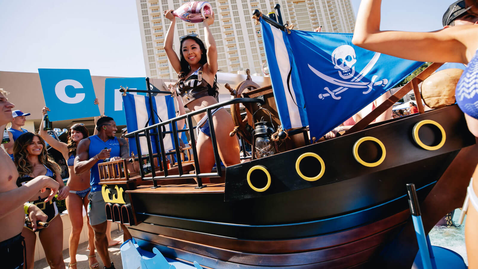 Waitress in pirate boat with champagne