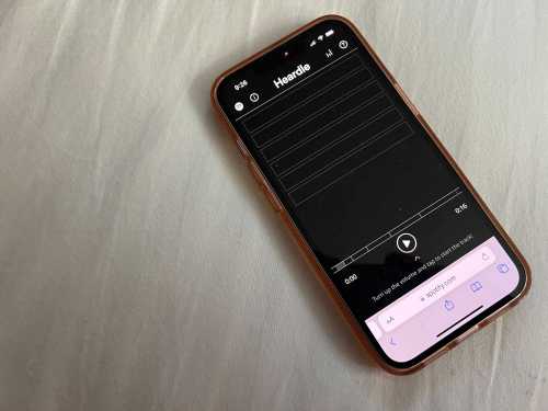 Spotify's Heardle game is displayed on an iPhone after its acquisition