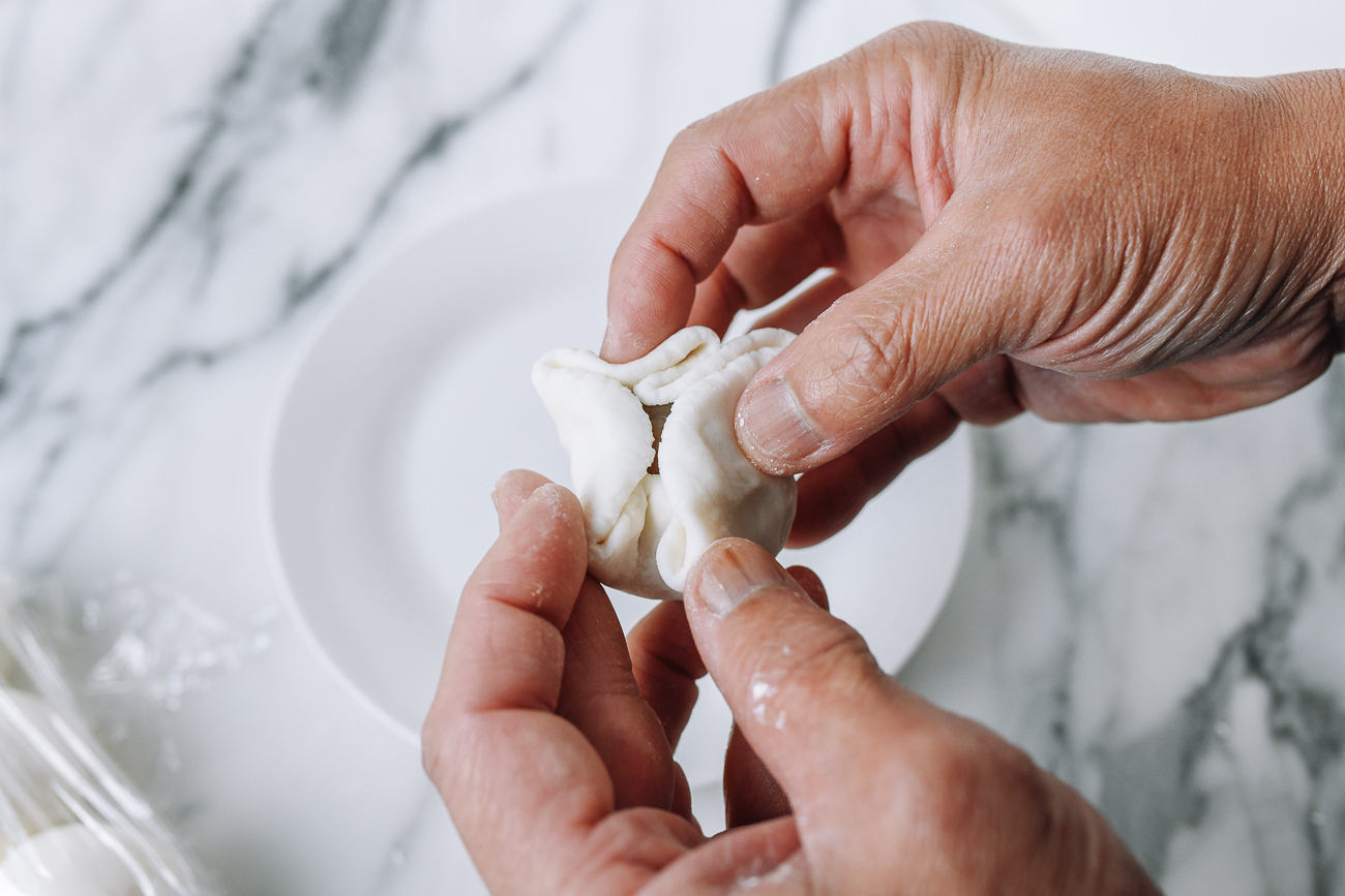 Wrapping dough around filling