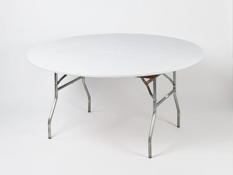 Round table standing on metal legs with a stretchy Kwik cover over the table on a white background.