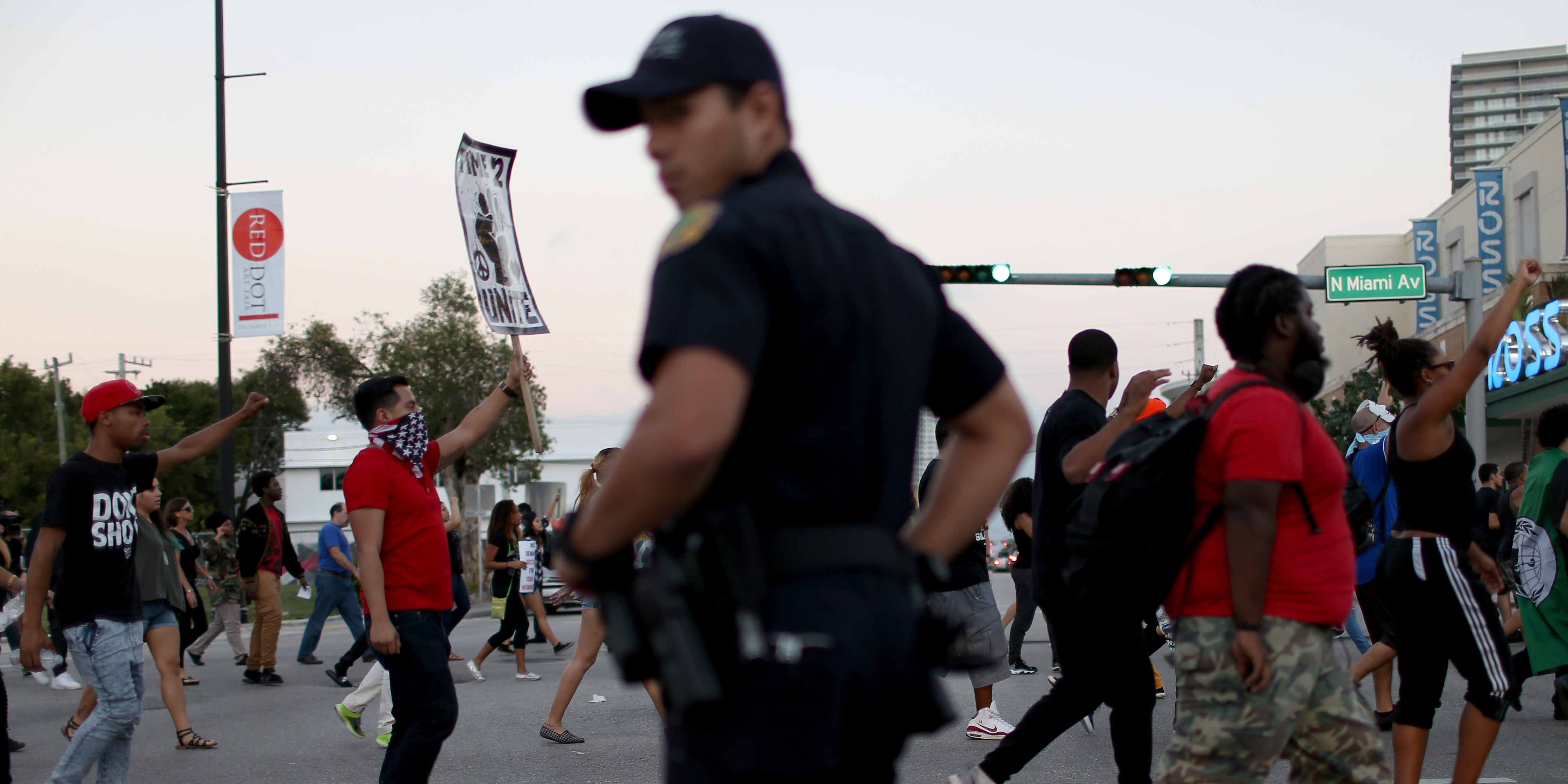 MIAMI, FL - DECEMBER 07: Demonstrators march through the Wynwood neighborhood to protest police abuse on December 7, 2014 in Miami, Florida. The protest was one of many that have take place nationwide after grand juries investigating the deaths of Michal Brown in Ferguson, Missouri and Eric Garner in New York failed to indict the police officers involved in both incidents (Photo by Joe Raedle/Getty Images)