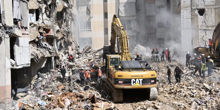 BEIRUT, LEBANON - SEPTEMBER 21: Officers use heavy construction equipment to remove debris from heavily damaged settlements following the Israeli army's air strike on the Dahieh district of southern Beirut, Lebanon on September 21, 2024. 31 people died and 68 were injured in an Israeli air strike. (Photo by Houssam Shbaro/Anadolu via Getty Images)