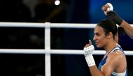 Algeria's Imane Khelif (Blue) reacts after beating Thailand's Janjaem Suwannapheng in the women's 66kg semi-final boxing match during the Paris 2024 Olympic Games at the Roland-Garros Stadium, in Paris on August 6, 2024. (Photo by Mauro PIMENTEL / AFP)
