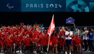 Canada's flagbearers and Paralympic athletes Patrick Anderson (C-L) and Katarina Roxon (C-R) parade during the Paris 2024 Paralympic Games Opening Ceremony in Paris on August 28, 2024. Photo by Gonzalo Fuentes / POOL / AFP.