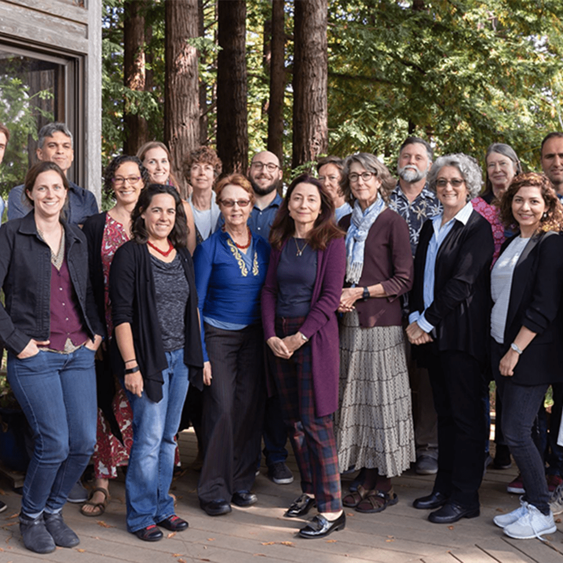 Faculty and TLC staff, seated and standing, posed picture.