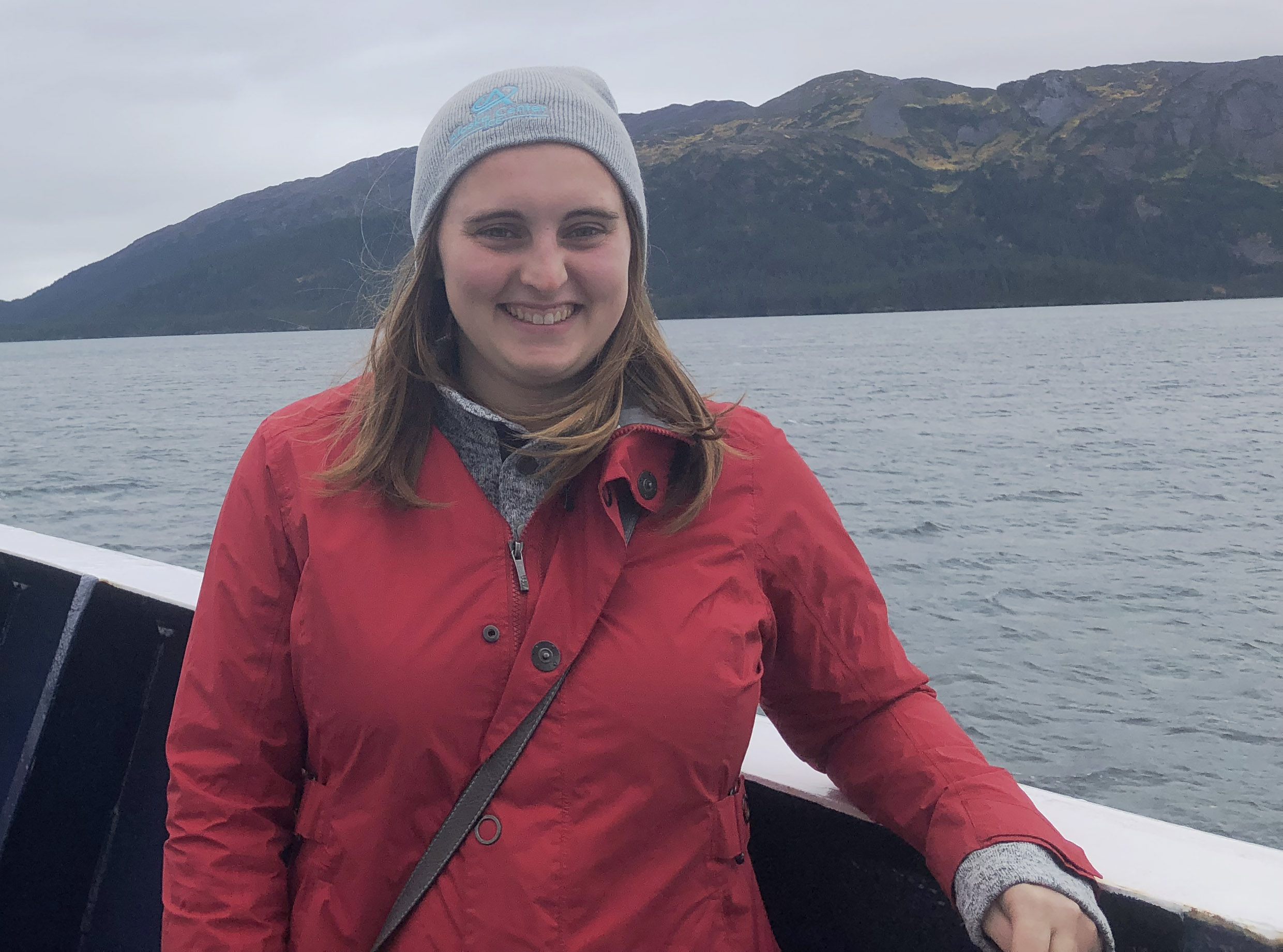 Woman standing on a boat smiling