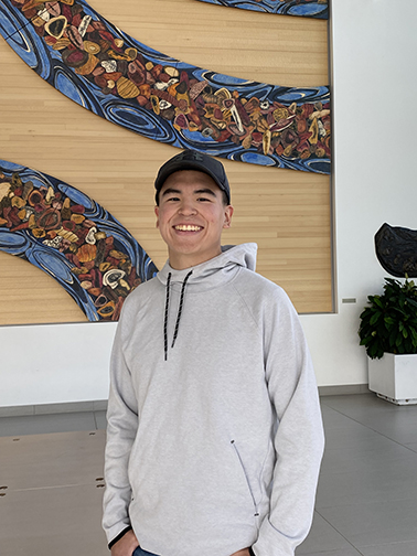 Photo of Orlin Gologergen, UAF BLaST Scholar standing in the Murie Lobby.