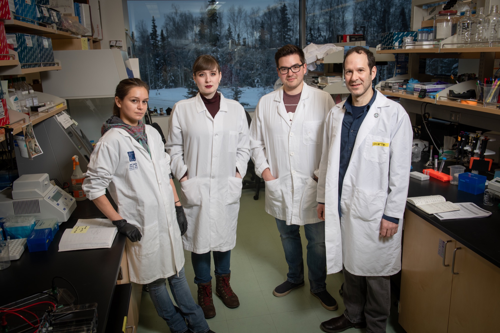 people in lab coats in a lab