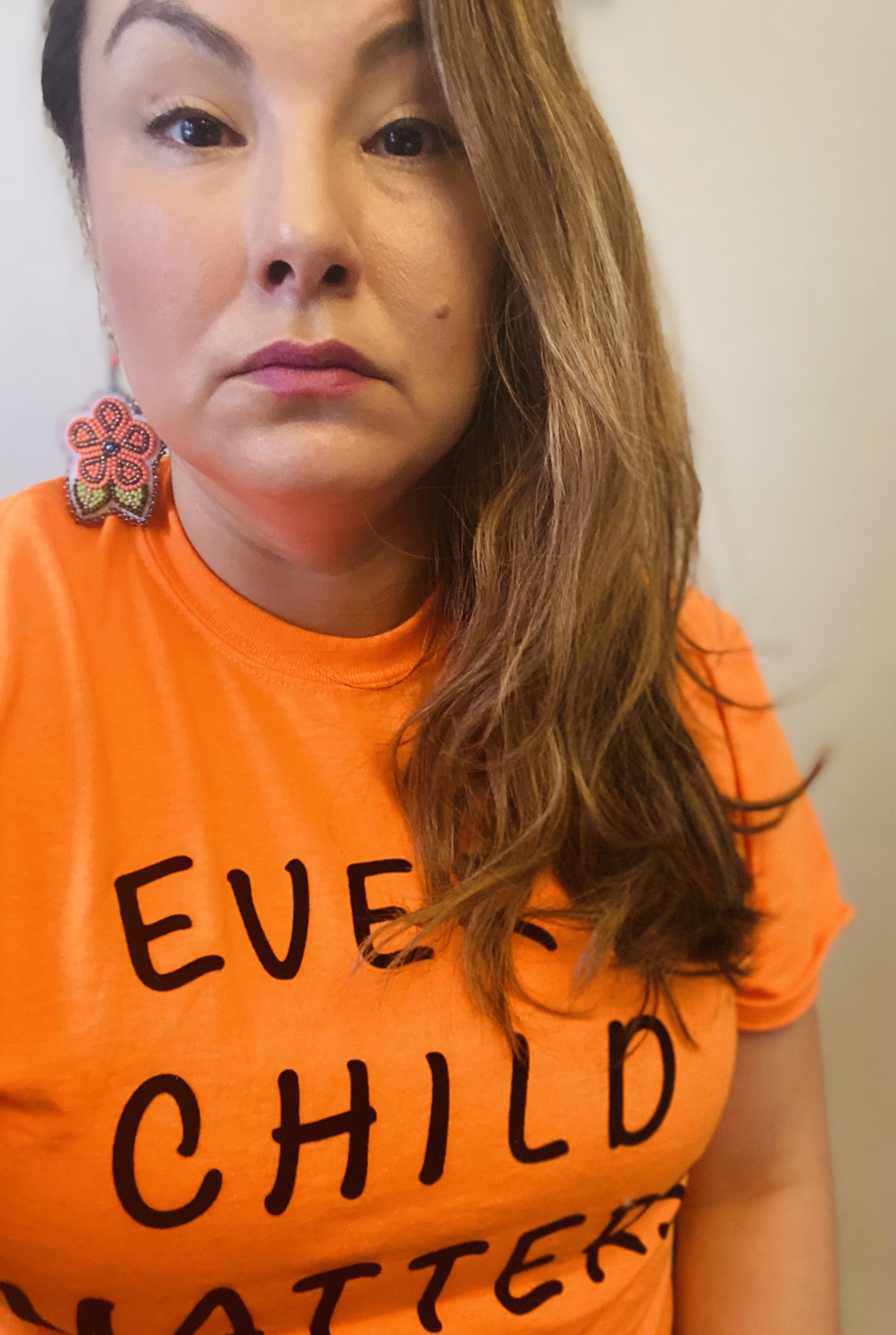 image of woman in orange t-shirt